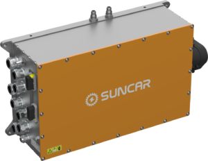 Industrial electronic module with orange front panel and multiple metallic connector ports on the left, SunCAR logo visible. (informative)